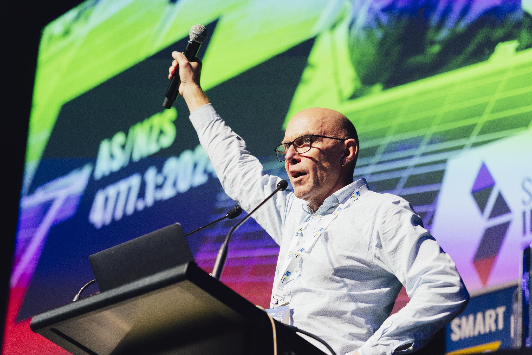 Geoff Bragg speaking at a solar industry event